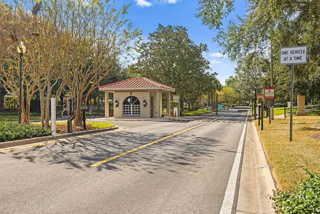 a view of a patio with a table and chairs