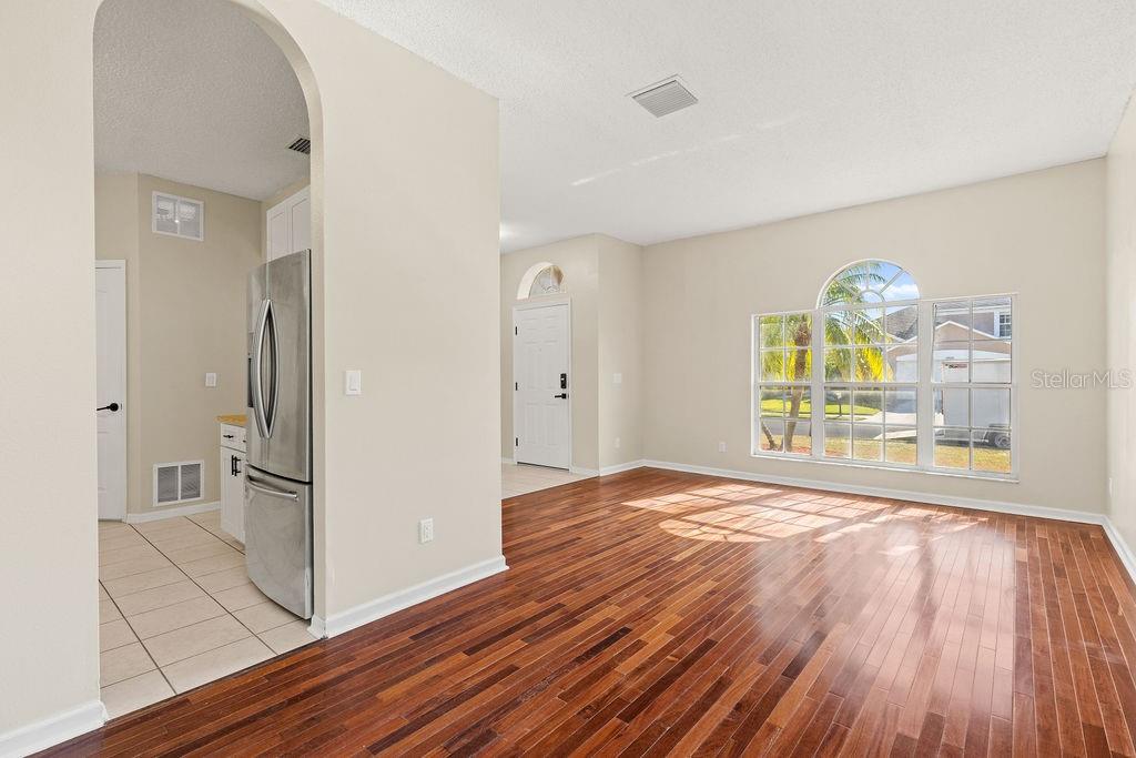 10641 Firebrick Court Trinity, FL 34655 - Photo 9 of 47 a view of empty room with wooden floor and fan