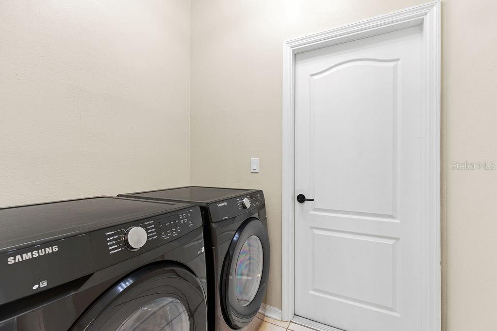 10641 Firebrick Court Trinity, FL 34655 - Photo 10 of 47 a utility room with dryer and washer
