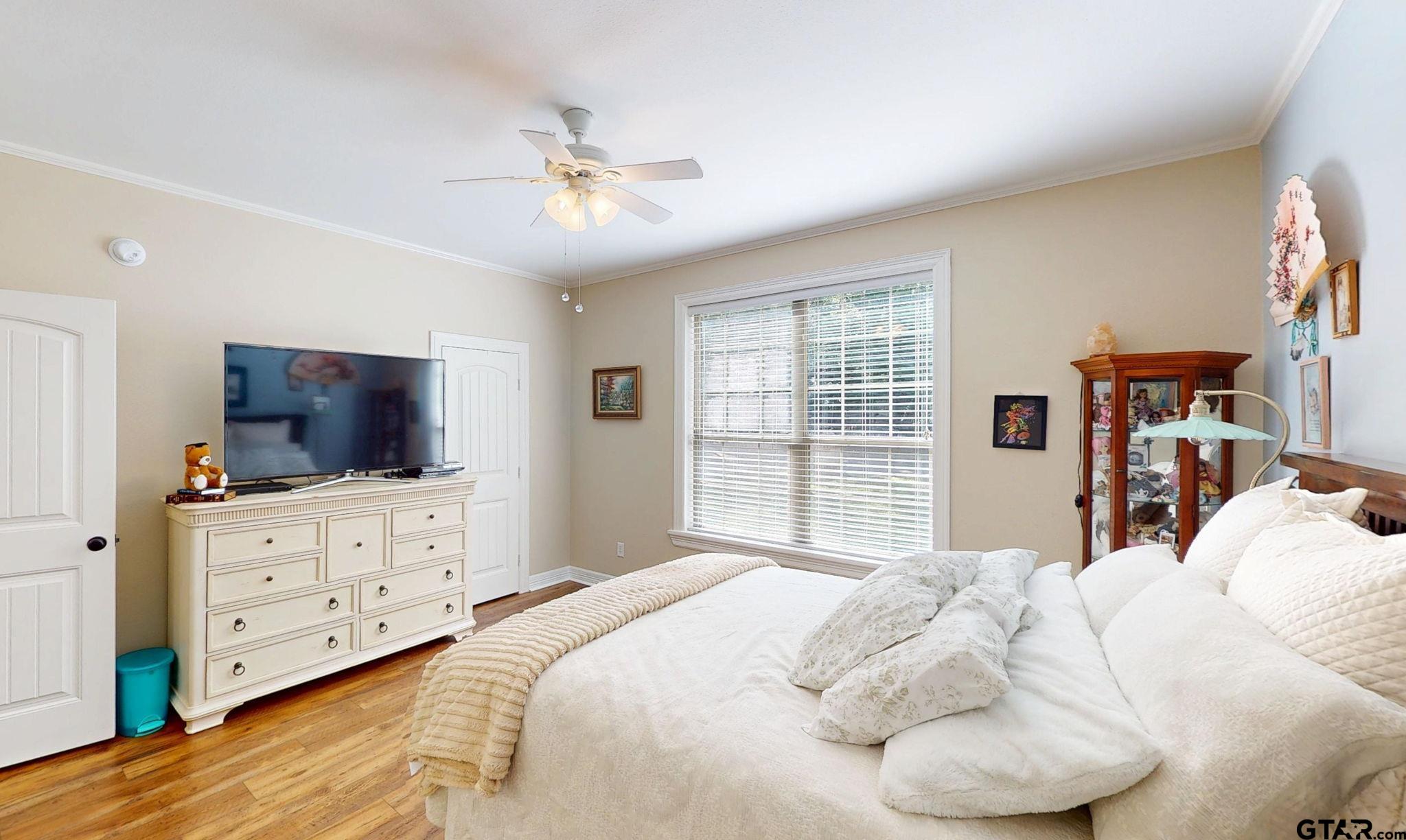 18488 Bluebird Circle Flint, TX 75762 - Photo 29 of 47 a bedroom with a bed and a flat screen tv