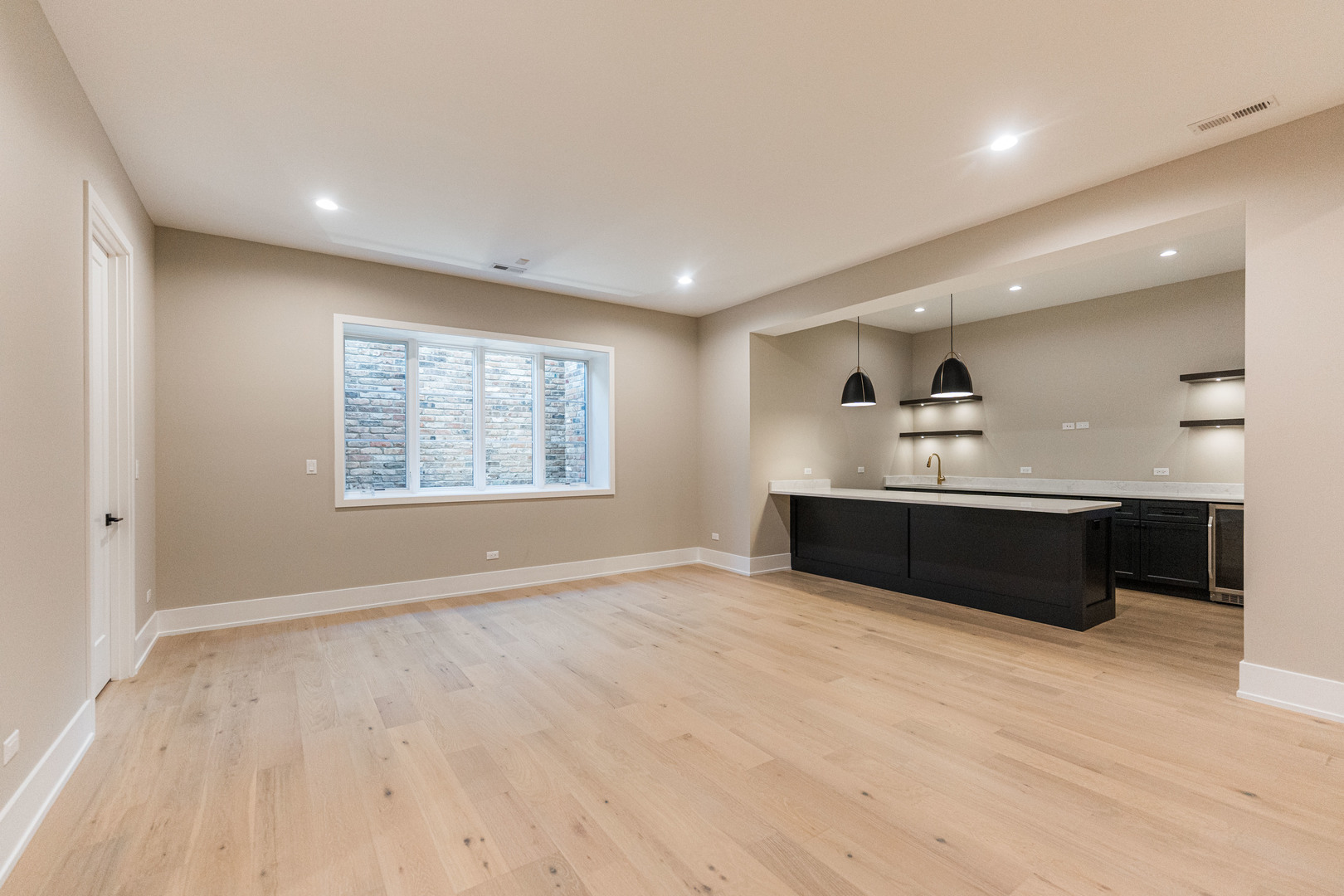 274 East Crescent Avenue Elmhurst, IL 60126 - Photo 19 of 22 a living room with stainless steel appliances kitchen island a large counter top and a wooden floor