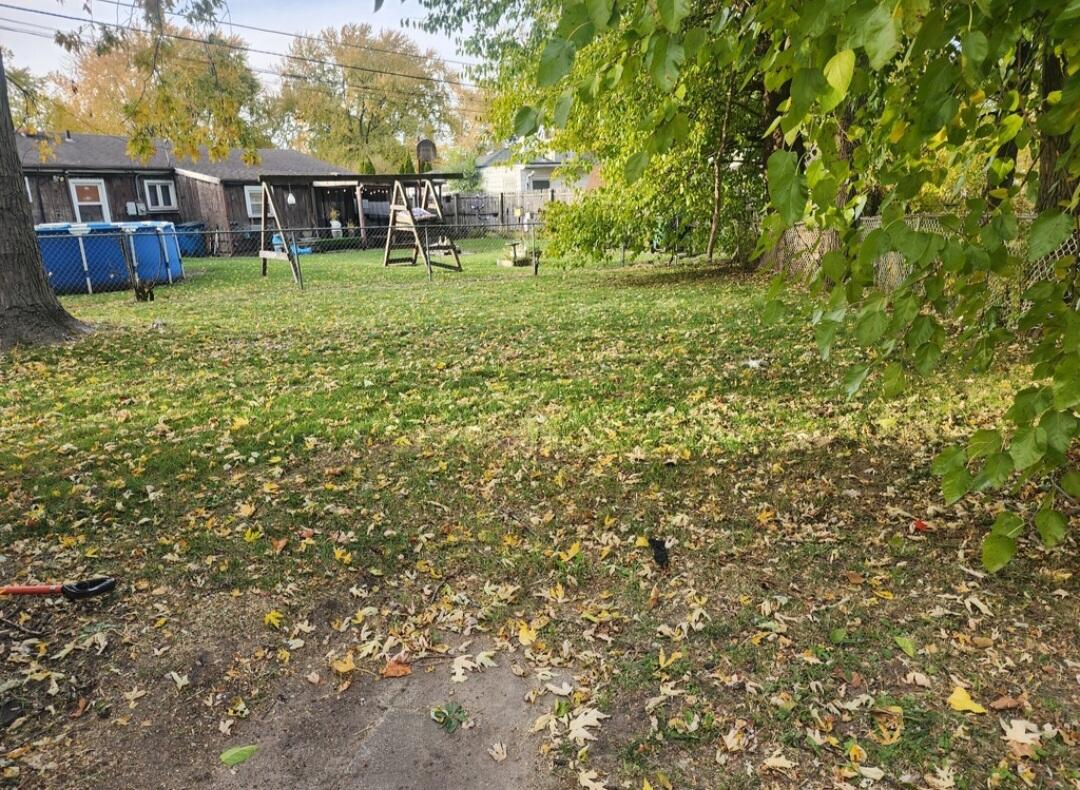 3515 164th Street Hammond, IN 46323 - Photo 12 of 12 a backyard of a house with table and chairs