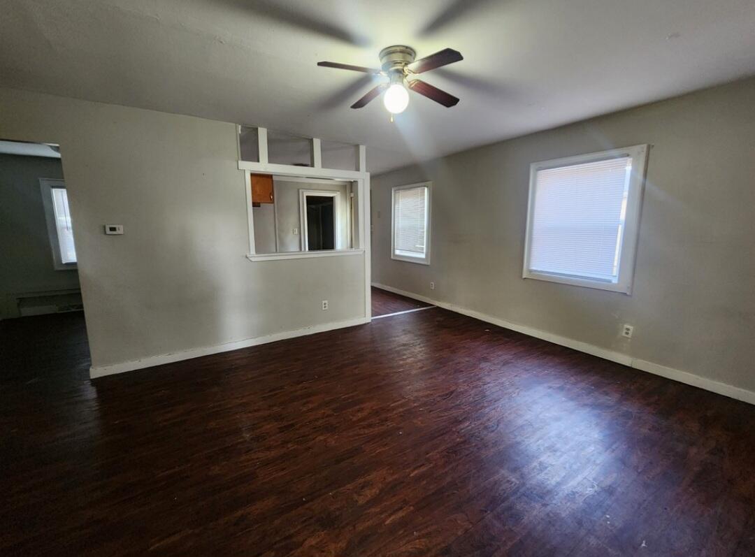 3515 164th Street Hammond, IN 46323 - Photo 2 of 12 a view of a livingroom with a ceiling fan window and wooden floor