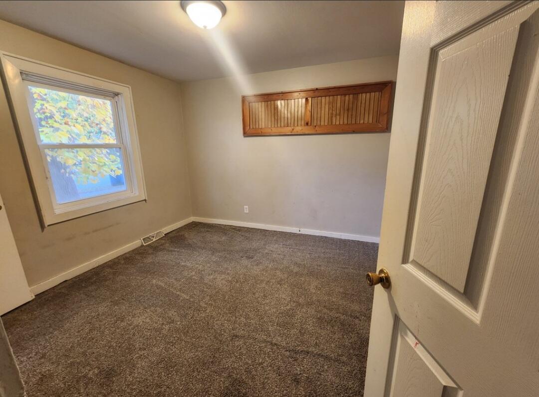 3515 164th Street Hammond, IN 46323 - Photo 4 of 12 an empty room with windows and closet