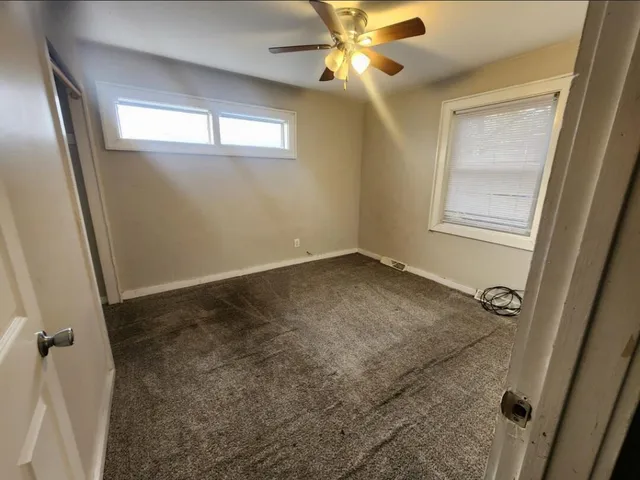 a view of a livingroom with a staircase