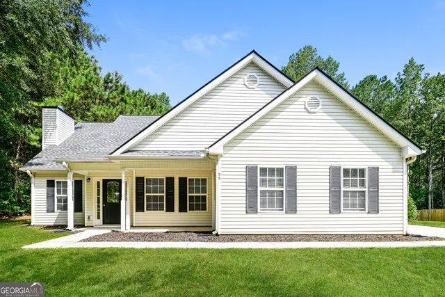 front view of a house with a yard