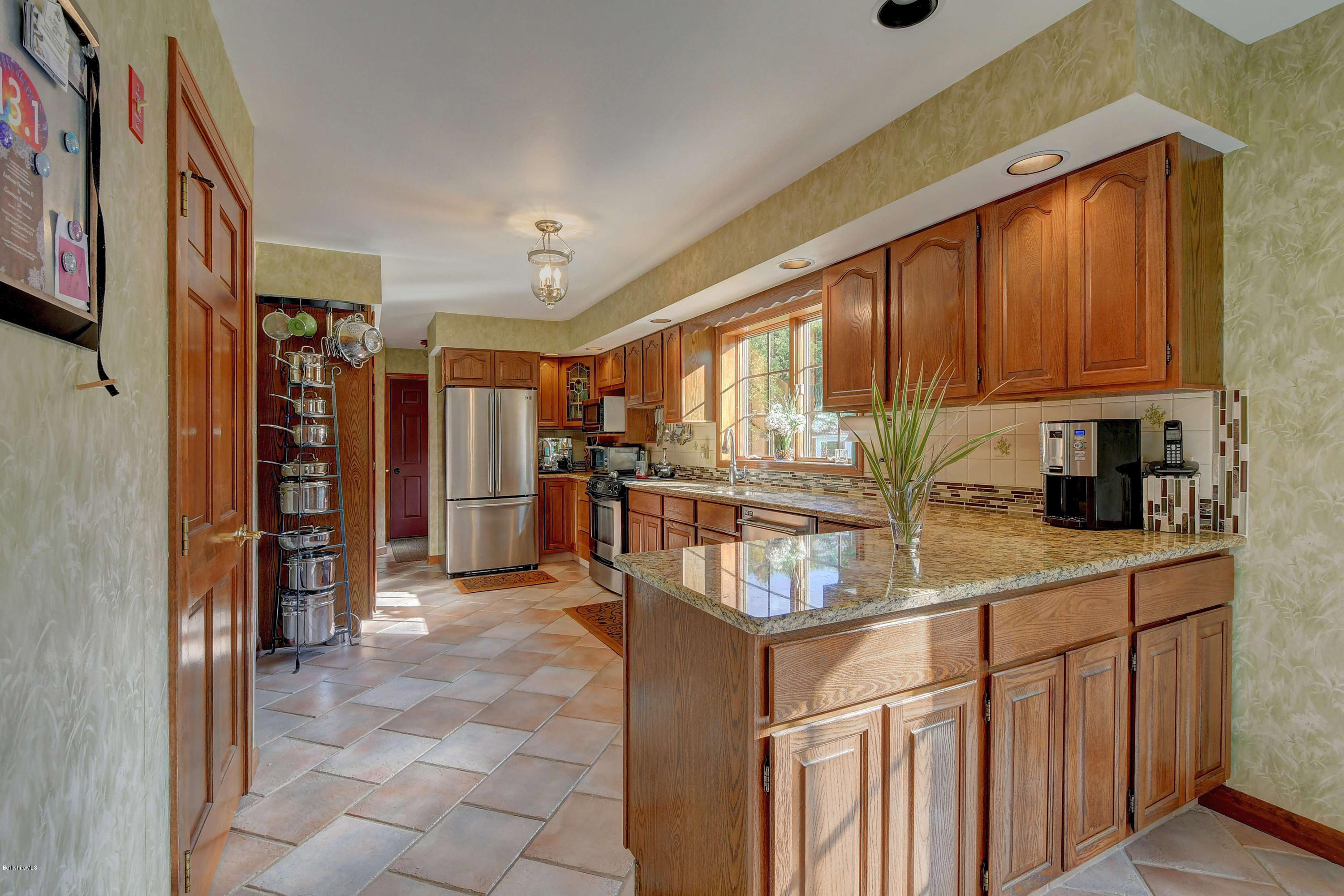 13 East Road Adams, MA 01220 - Photo 8 of 27 a kitchen with stainless steel appliances granite countertop a refrigerator and a sink