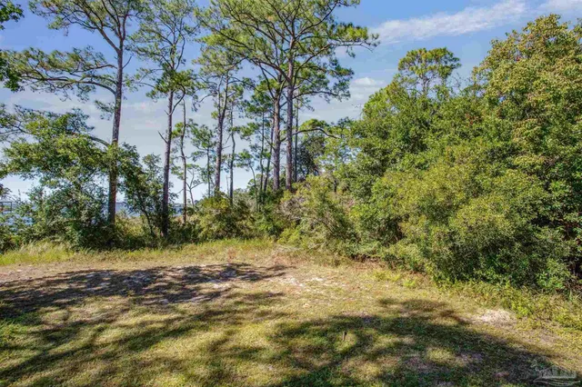 a view of a road with a building in the background