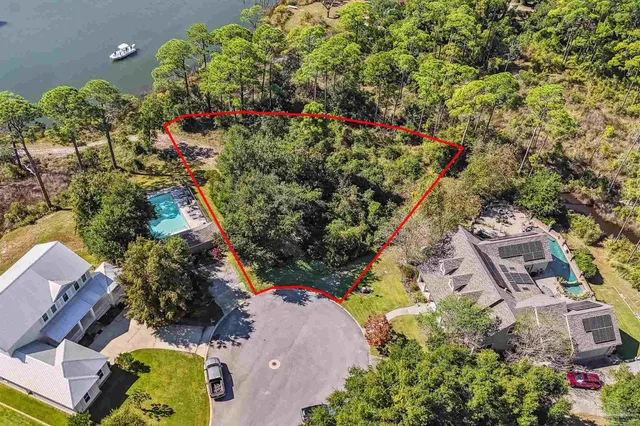 an aerial view of residential house with outdoor space and swimming pool