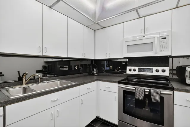 a bathroom with a shower and a sink