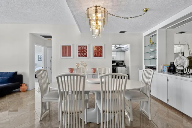 a view of a dining room that has a table and chairs