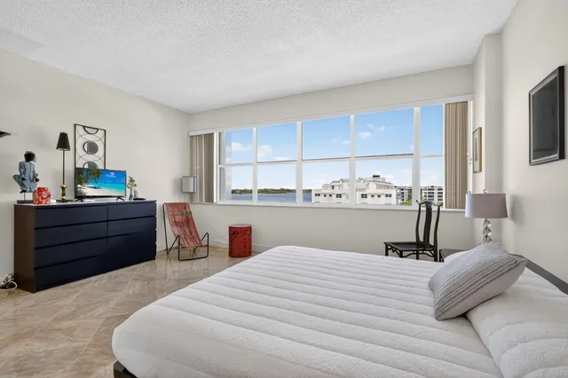 a kitchen with a white cabinets and white appliances