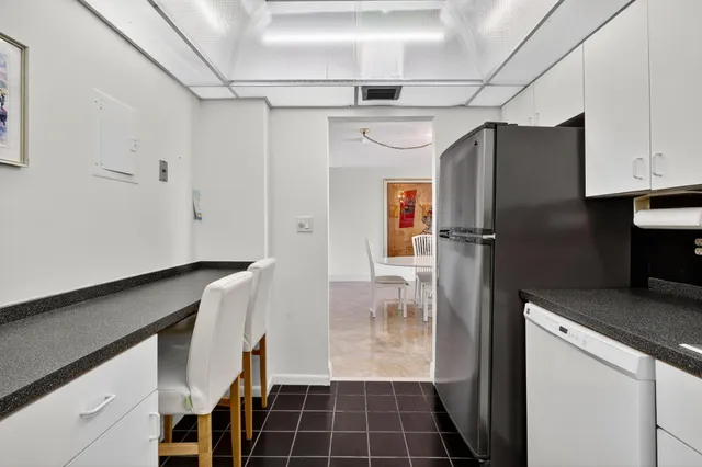 a view of a yard with potted plants