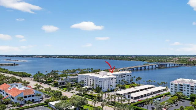 an aerial view of a house with a lake view