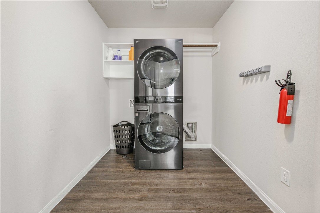 4703 Coyotillo Way Bryan, TX 77807 - Photo 13 of 24 a view of a hallway with wooden floor and closet
