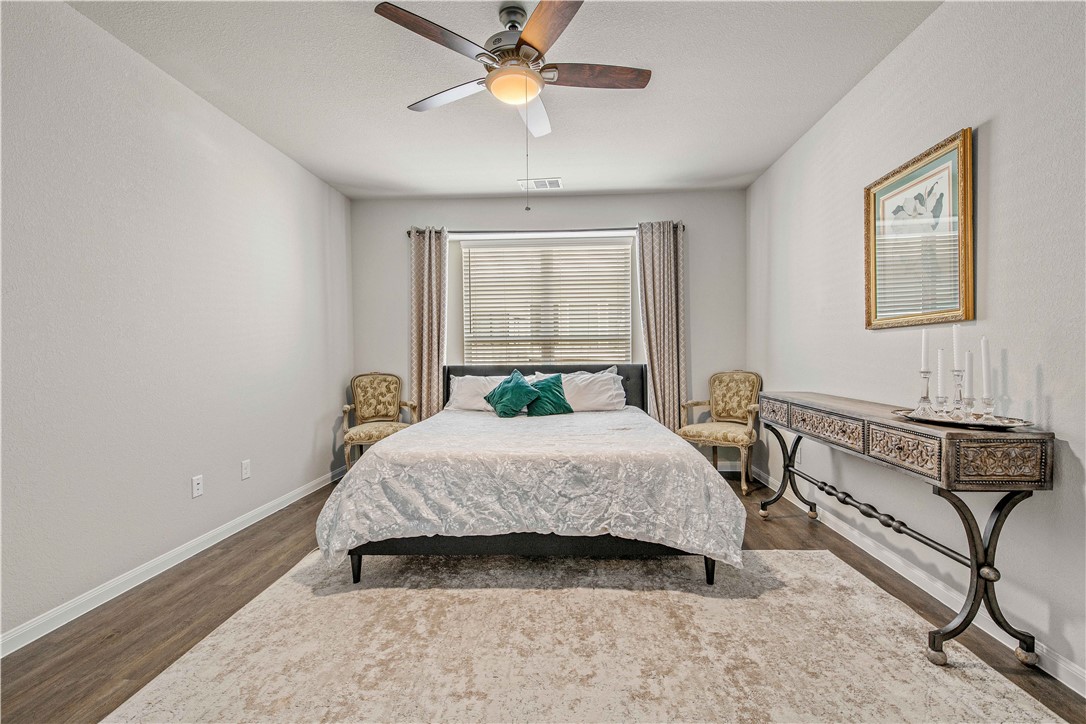 4703 Coyotillo Way Bryan, TX 77807 - Photo 22 of 24 a bedroom with a bed and window