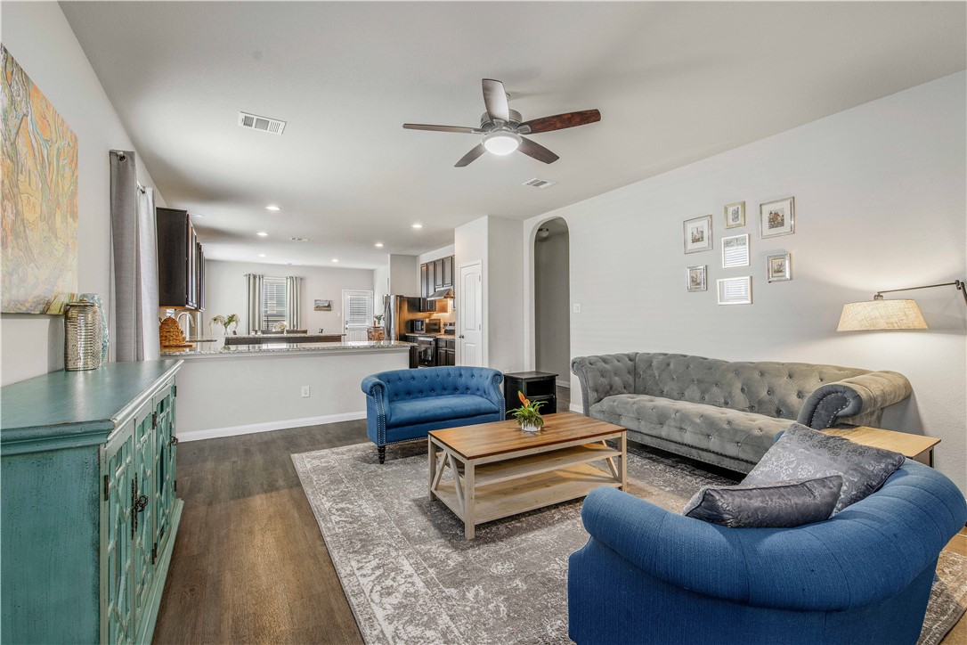 4703 Coyotillo Way Bryan, TX 77807 - Photo 4 of 24 a living room with furniture and kitchen view