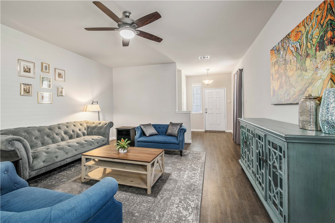 4703 Coyotillo Way Bryan, TX 77807 - Photo 5 of 24 a living room with furniture and a wooden floor