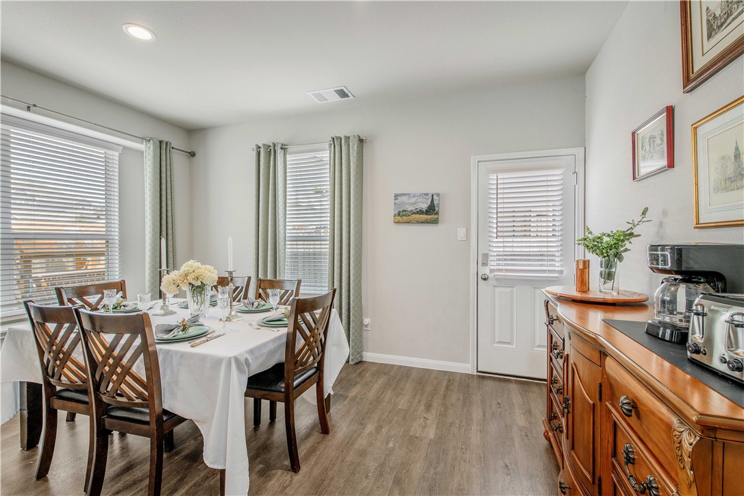 4703 Coyotillo Way Bryan, TX 77807 - Photo 9 of 24 a view of a dining room with furniture and window