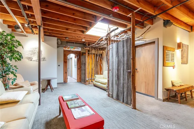 a view of walk in entryway with wooden floor and door