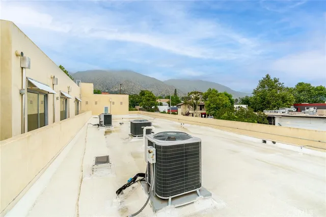 a living room with furniture and a kitchen