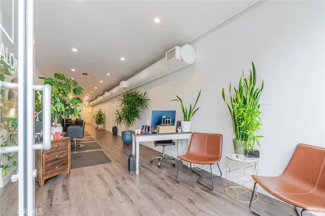 a bathroom with a sink toilet and a mirror