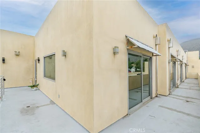 a view of cars parked in front of a house