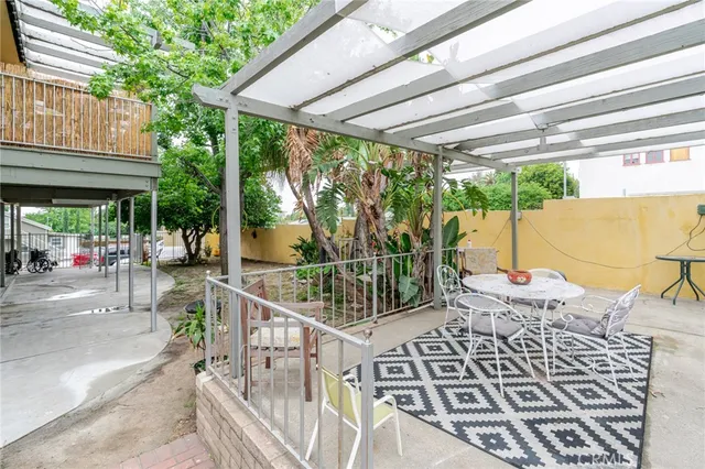 a room with white cabinets and white appliances