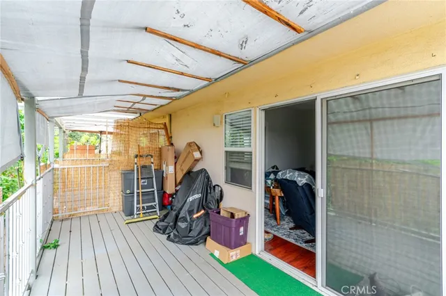 a kitchen with a stove a refrigerator and wooden floor