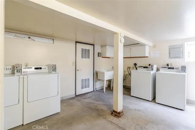 a bedroom with a bed and a cabinets