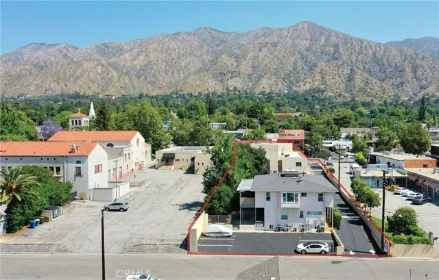 a view of cars parked in front of a building