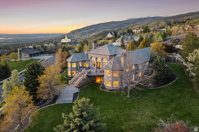 1714 Ridge Point Drive Bountiful, UT 84010 - Photo 125 of 132 Stone exterior with multiple bay windows, a prominent deck, and a multi-level staircase