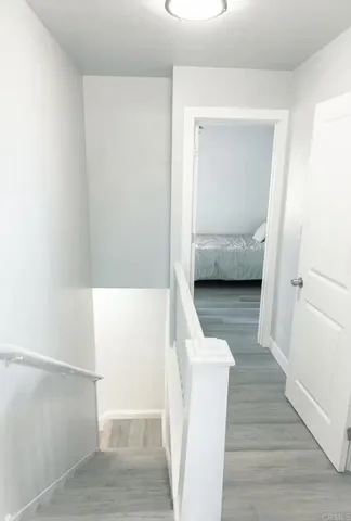 a view of a bedroom from a hallway