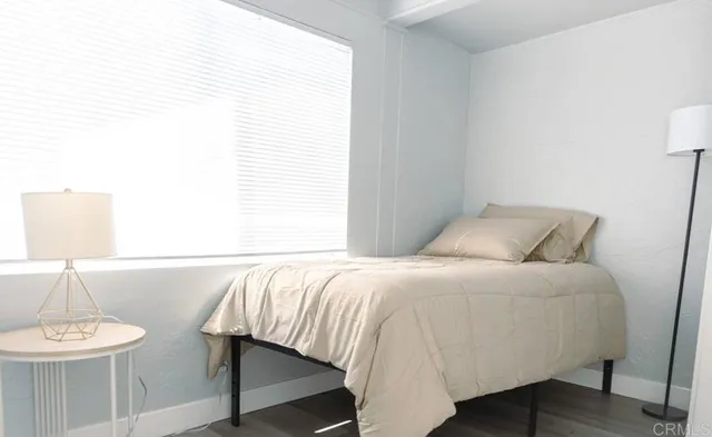 a bedroom with a bed and a table