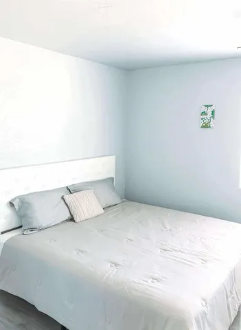 a bedroom with a bed