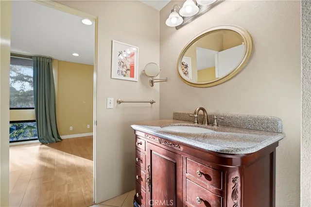 a bathroom with a sink and a mirror