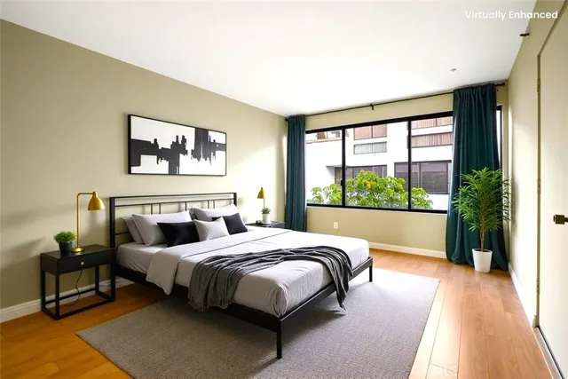 a bedroom with bed and a window