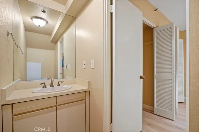 a bathroom with a double vanity sink and a mirror