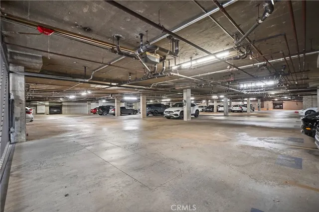 a view of parking garage with cars