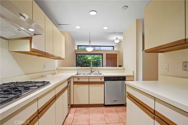 a kitchen with a stove and a sink