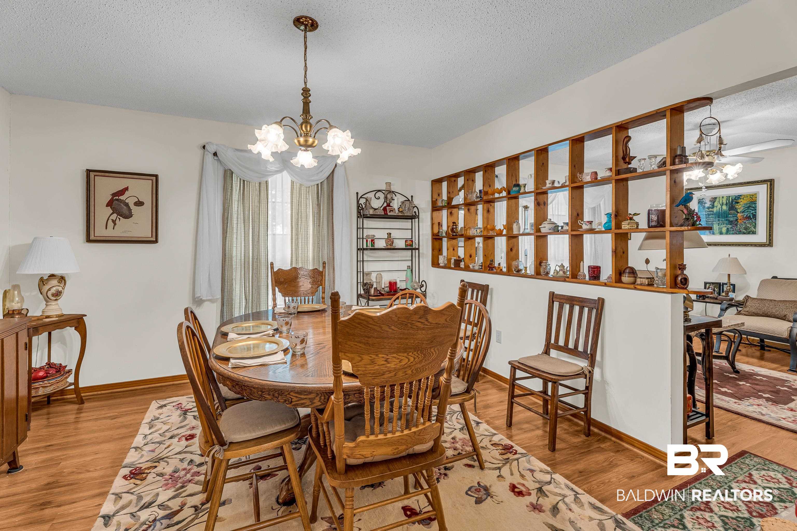 72075 Highway 59 Little River, AL 36550 - Photo 14 of 40 Dining space with a chandelier, a textured ceiling, and light wood-style floors