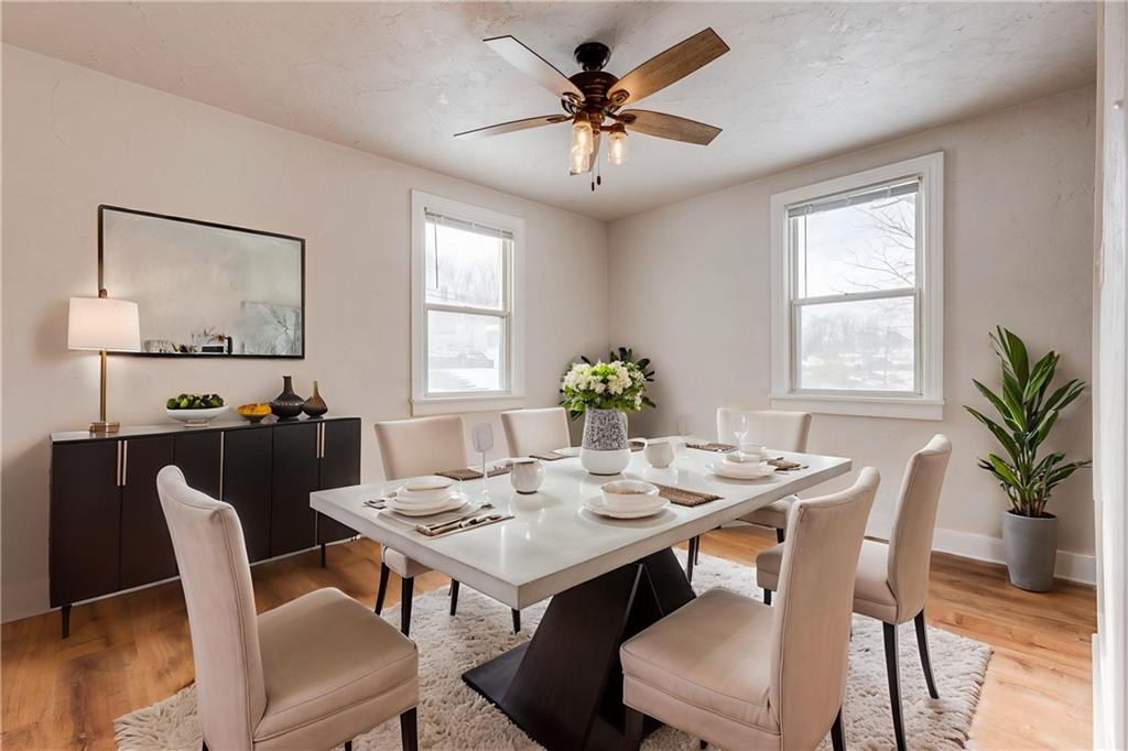 11561 Center Street Irwin, PA 15642 - Photo 11 of 46 a view of a dining room with furniture window and wooden floor