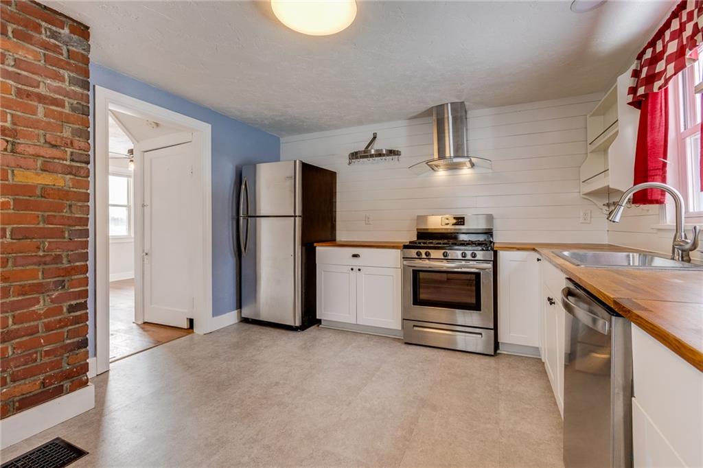 11561 Center Street Irwin, PA 15642 - Photo 17 of 46 a kitchen with a stove and a refrigerator