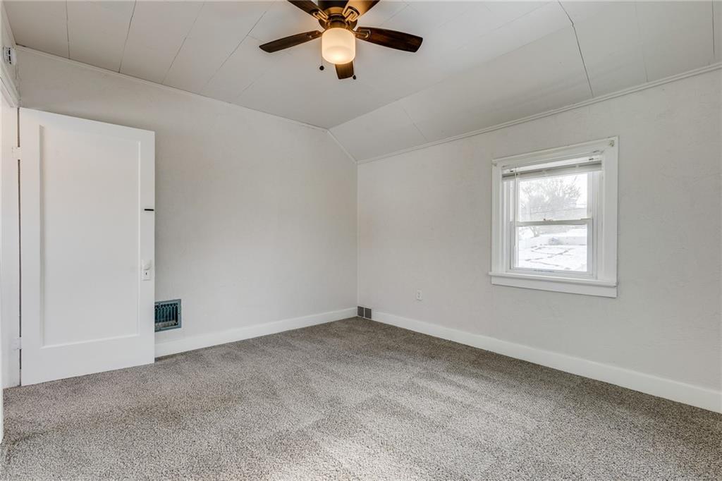 11561 Center Street Irwin, PA 15642 - Photo 31 of 46 an empty room with a window and a fan