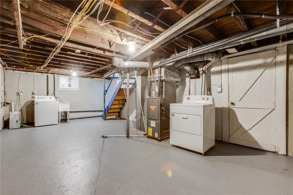 11561 Center Street Irwin, PA 15642 - Photo 34 of 46 a view of storage and utility room with stairs