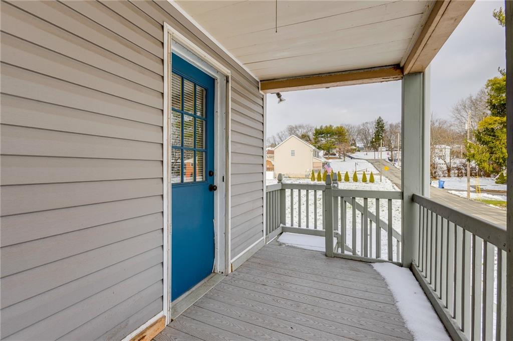 11561 Center Street Irwin, PA 15642 - Photo 41 of 46 a view of a porch with wooden floor