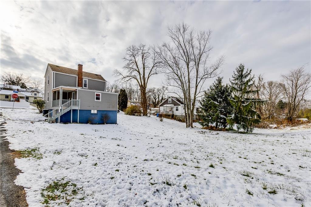 11561 Center Street Irwin, PA 15642 - Photo 45 of 46 a street view covered with snow
