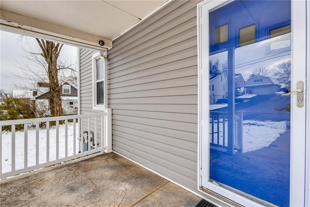 11561 Center Street Irwin, PA 15642 - Photo 5 of 46 a view of a porch with wooden floor