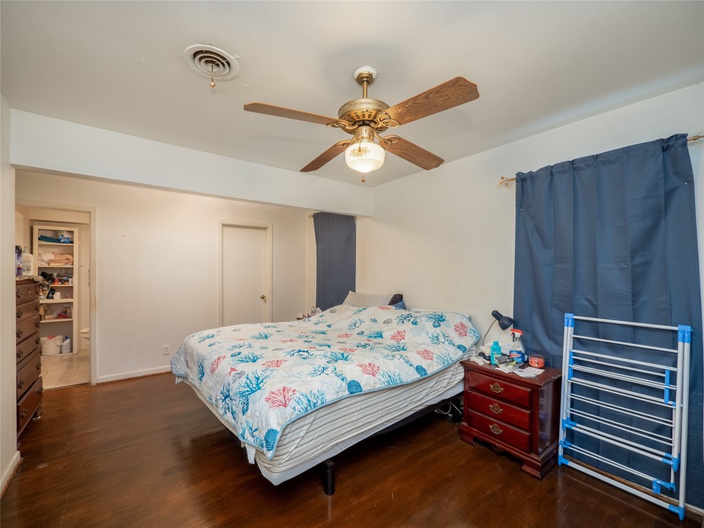 1409 Zephyr Road Killeen, TX 76541 - Photo 12 of 31 a bedroom with a bed and a chandelier