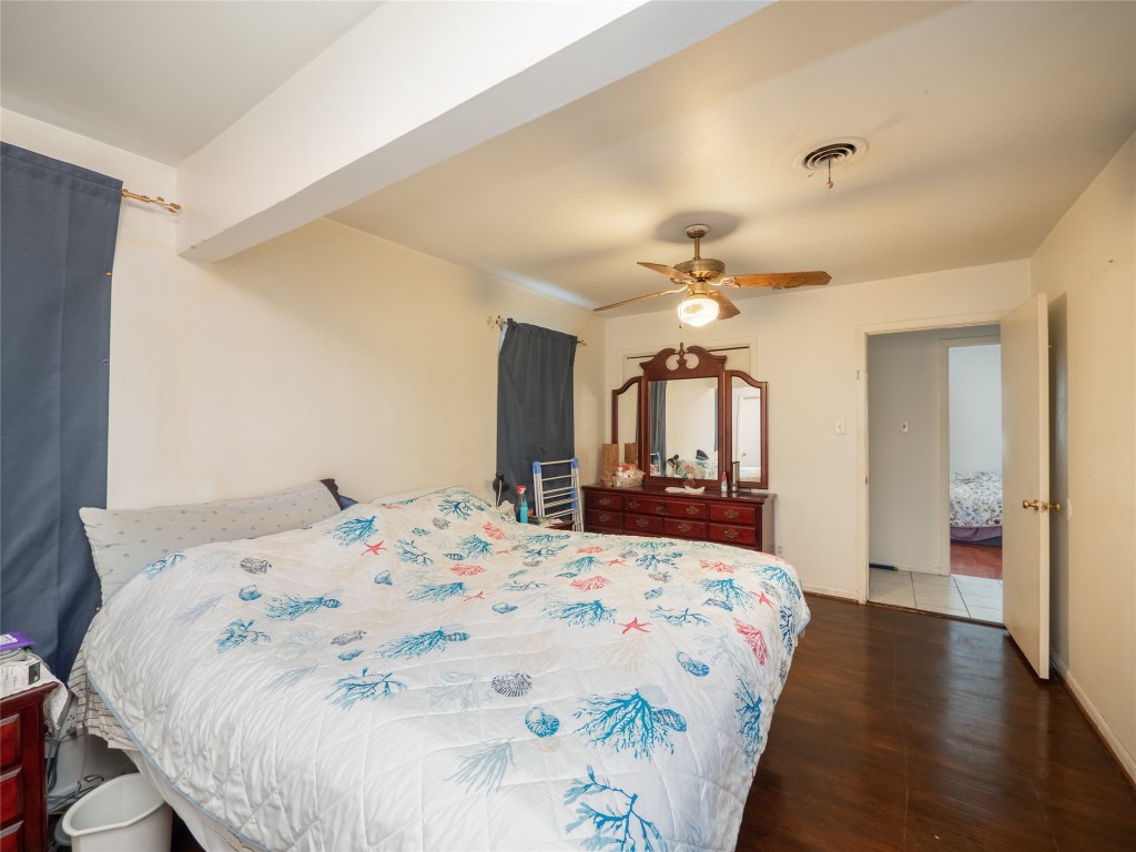 1409 Zephyr Road Killeen, TX 76541 - Photo 13 of 31 a bedroom with a bed and a chandelier